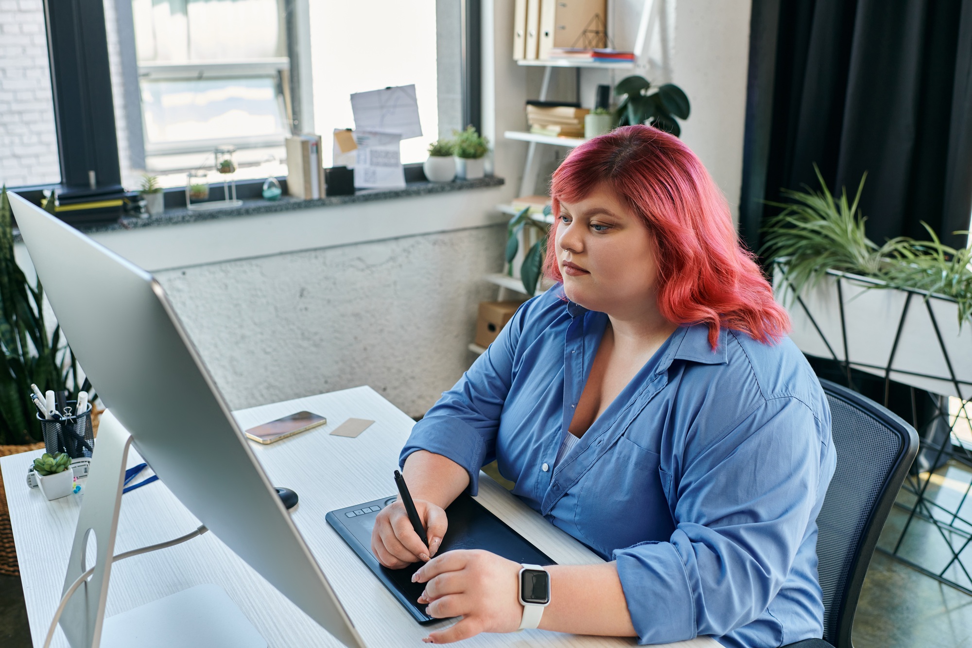 Creative Focus: A Woman Works on Her Digital Design
